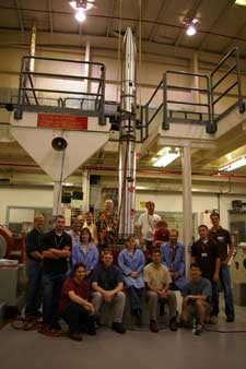 Robertson payload team with payload on vibration table