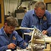 Mechanical and electrical techs with payload section.