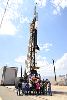 OAxFORTIS mission team with rocket on launcher at White Sands Missile Range, NM.