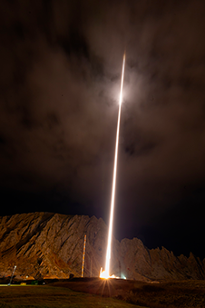 OAxFORTIS mission team with rocket on launcher at White Sands Missile Range, NM.